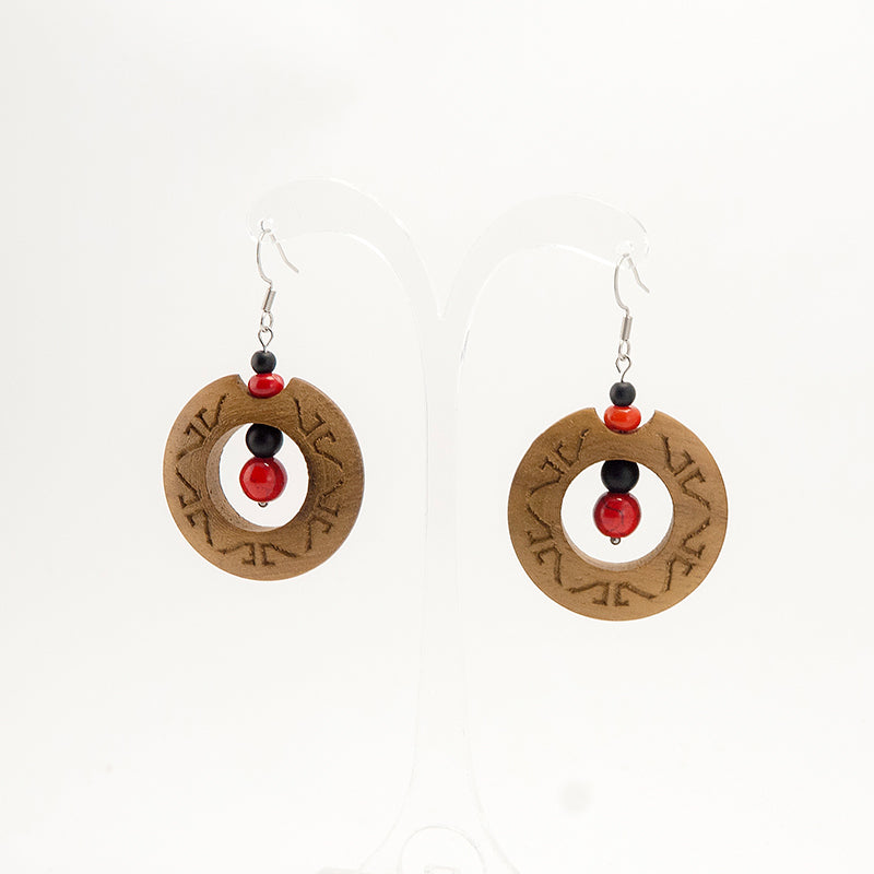 Dipti. Iroko Circle Wooden Earrings with Engraved surface and Red - Black beads A056-1